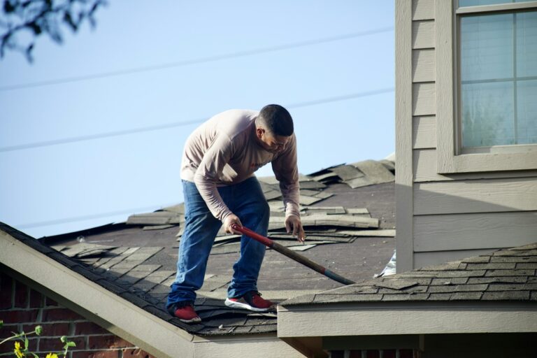 Homeowner reviews a detailed roofing proposal with a contractor beside a residential roof.